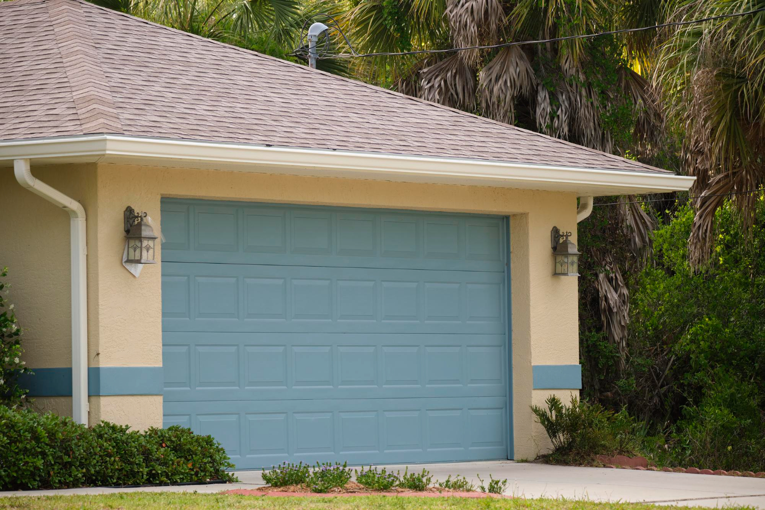 wide-garage-double-door-and-concrete-dri